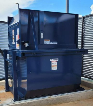 large white trash compactor
