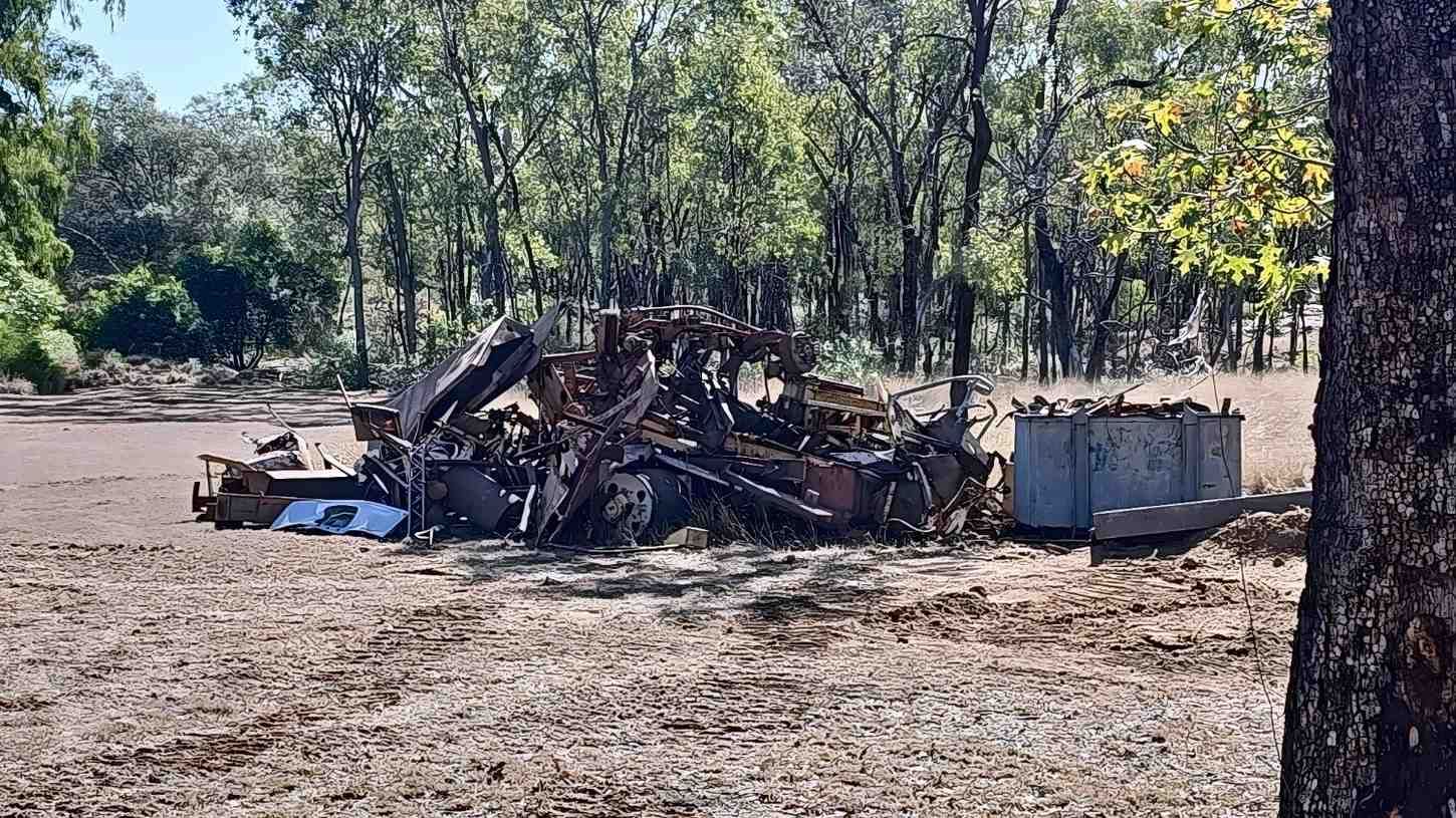 Burnt Out Vehicle Wreckage in a Dry, Outdoor Setting — NPX Solutions In Gympie, QLD