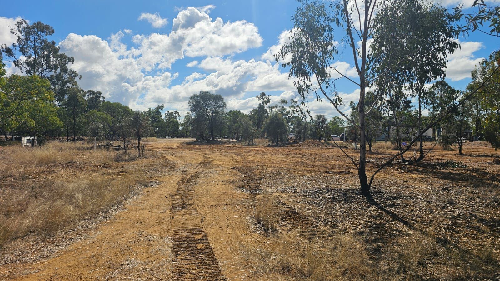 Dirt Track Through Dry, Grassy Field With Scattered Trees — NPX Solutions In Gympie, QLD
