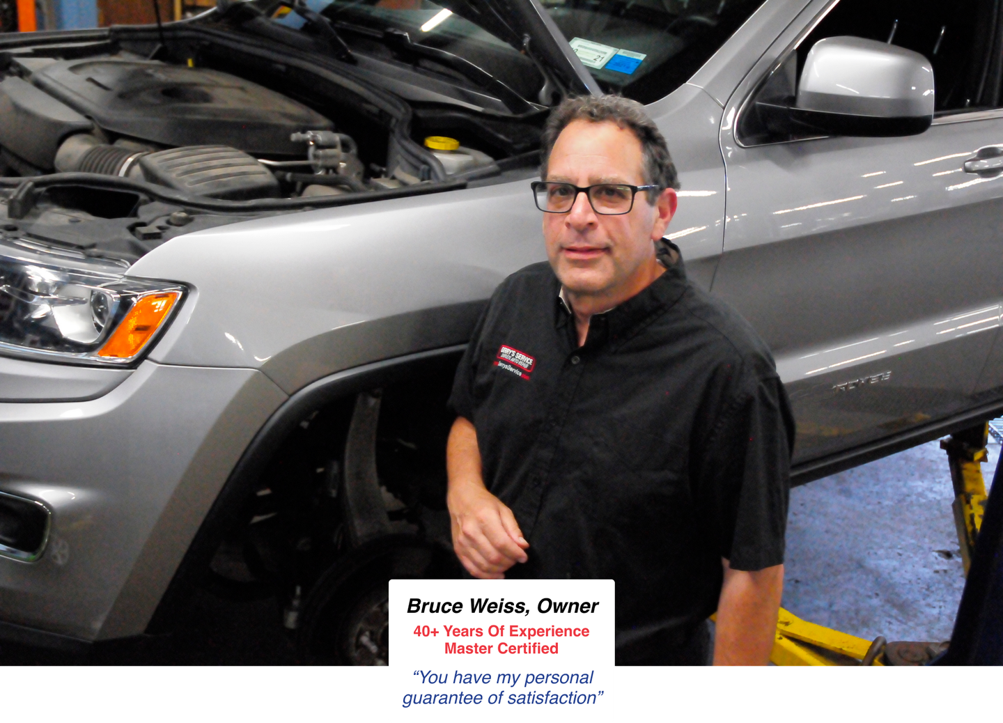 Man in black shirt stands near a car in a garage, next to text identifying him as an auto shop owner.