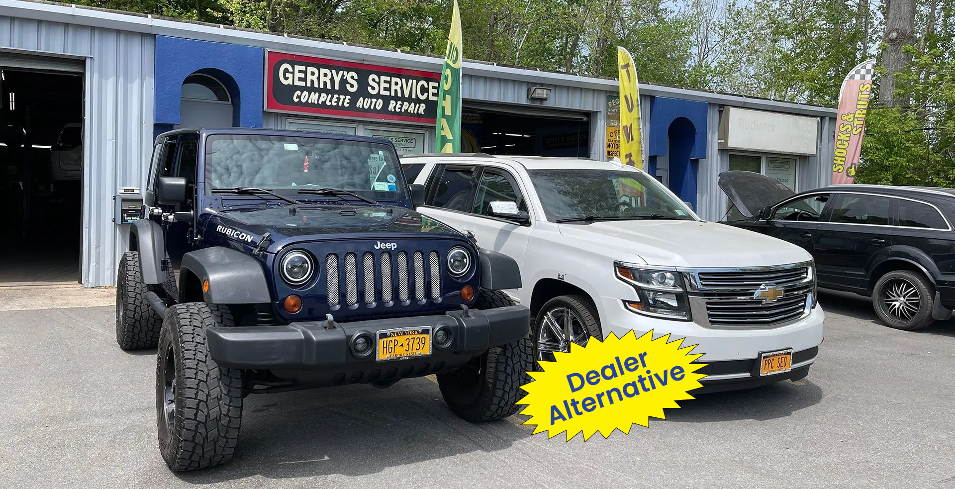 Jeep Wrangler and Chevy Tahoe parked at 