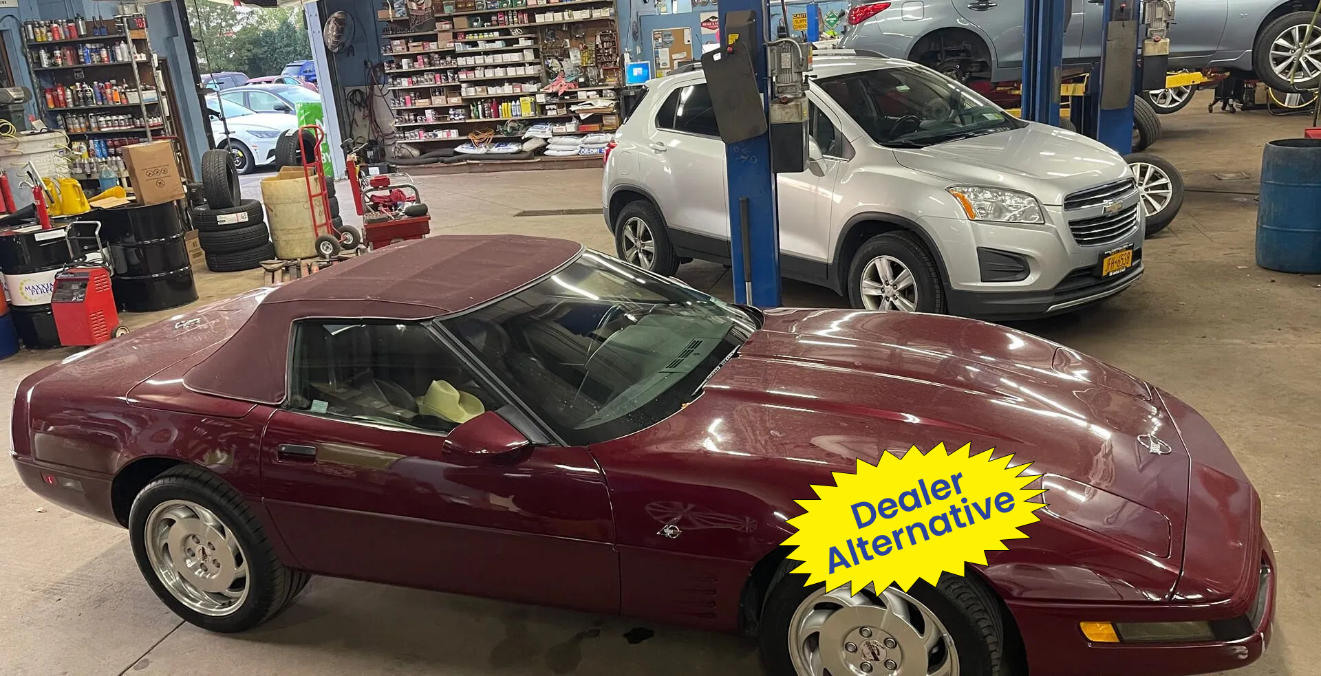 A burgundy convertible sports car with a 