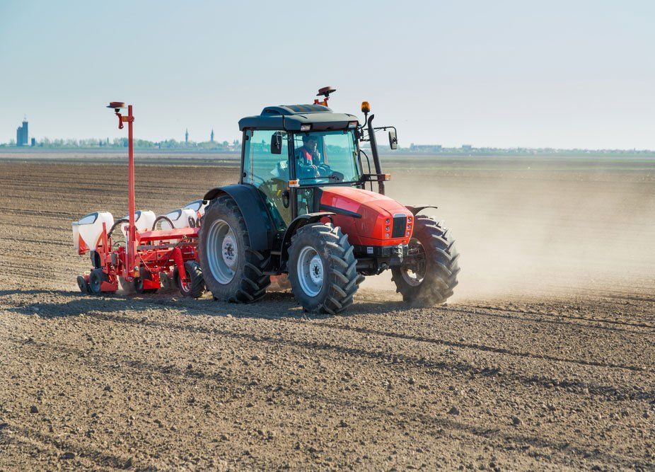 Farmer Seeding Crops at Farmland — O'Brien's Machinery In Taree