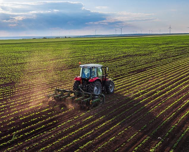 Tractor Cultivating The Farmland — O'Brien's Machinery In Maitland