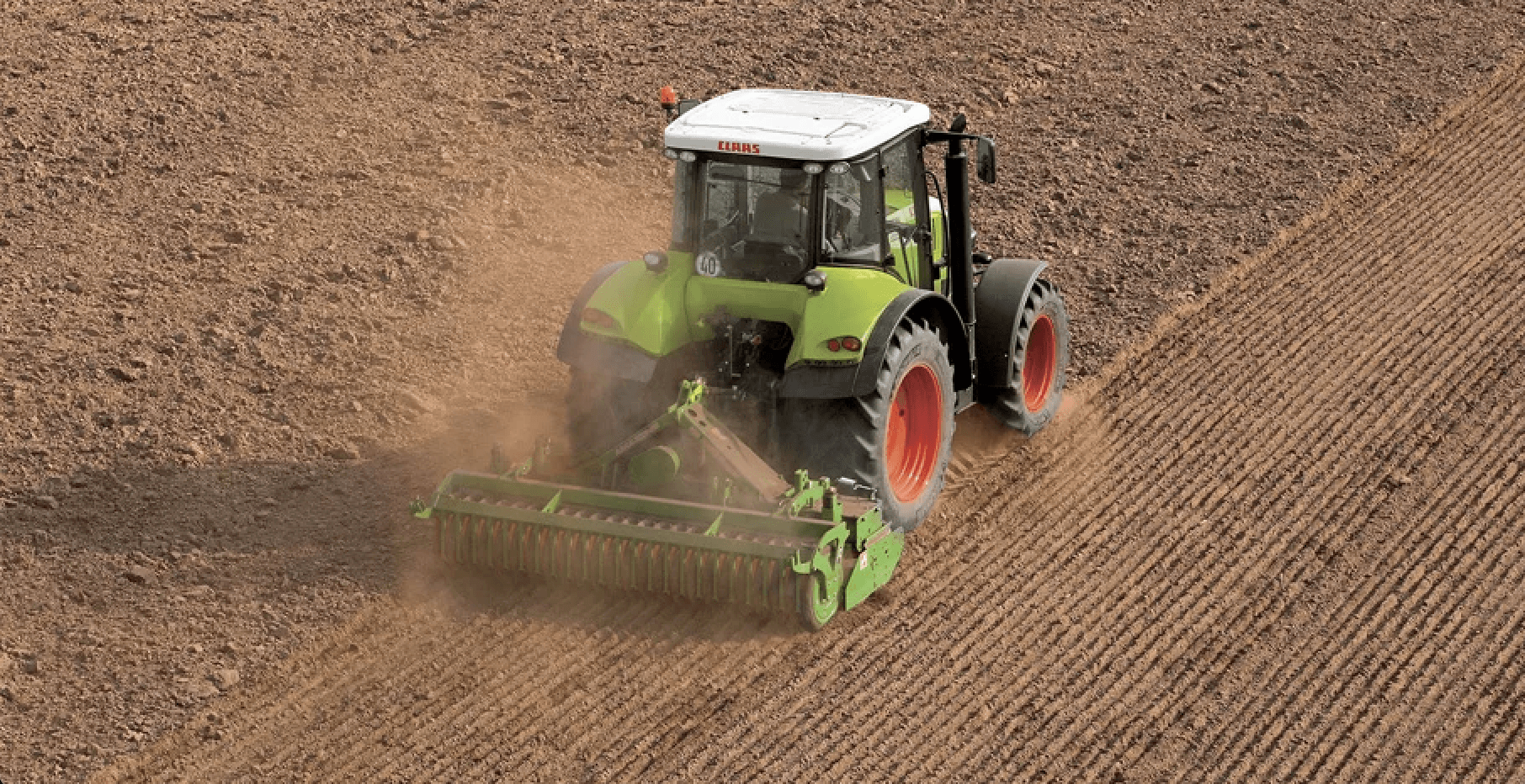 Farmer In Tractor Preparing Land With Seedbed Cultivator — O'Brien's Machinery In Hunter Valley NSW