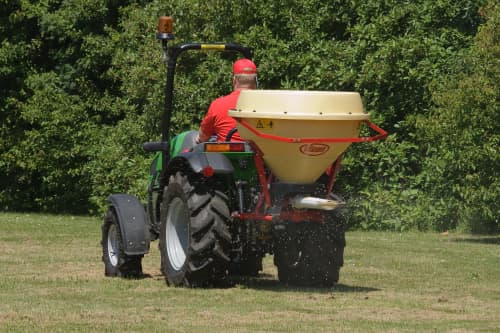 Man at Tractor Mowing on Open Field — O'Brien's Machinery In Hunter Valley NSW