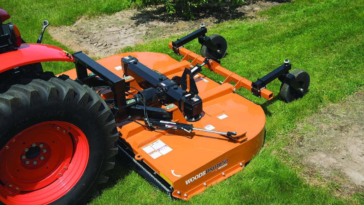 A Tractor Being Used To Cut Grass — O'Brien's Machinery In Hunter Valley NSW