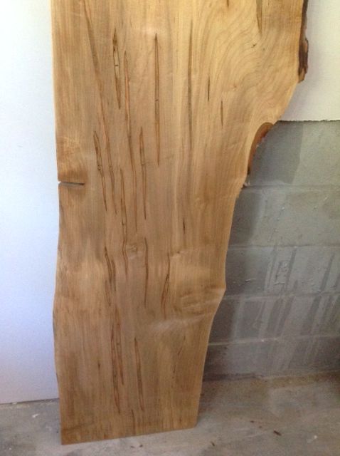 a piece of wood that has a striped pattern on it