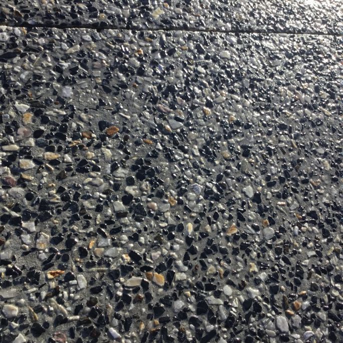 A Close Up Of A Gray And Black Concrete Surface — River2Coast Concreting in Boambee, NSW