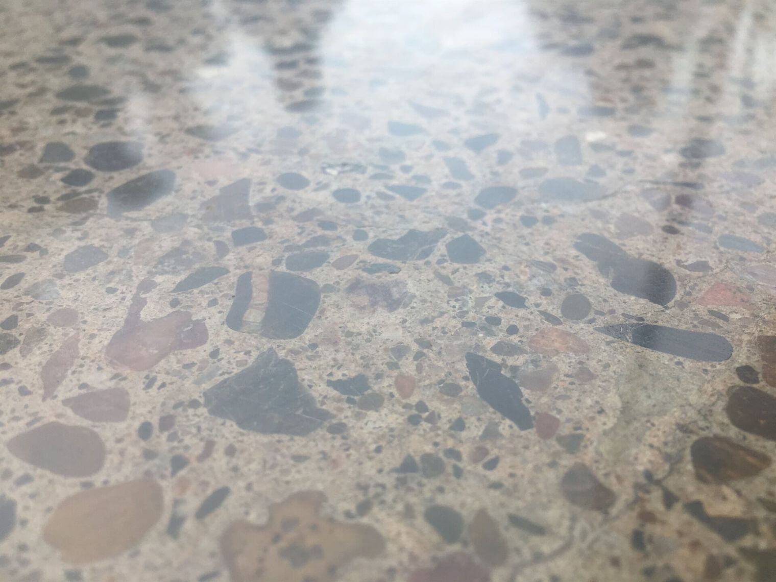 A Close Up Of A Marble Counter Top With A Lot Of Rocks On It  — River2Coast Concreting in Grafton, NSW