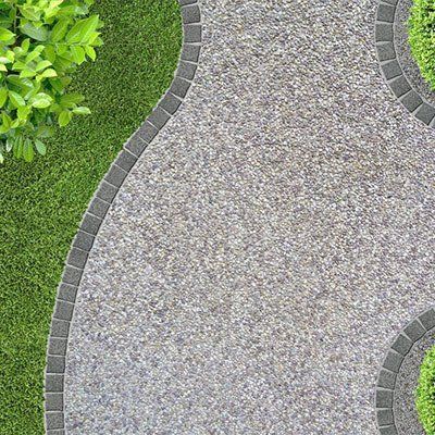 An Aerial View Of A Curved Walkway In A Garden  — River2Coast Concreting in Boambee, NSW