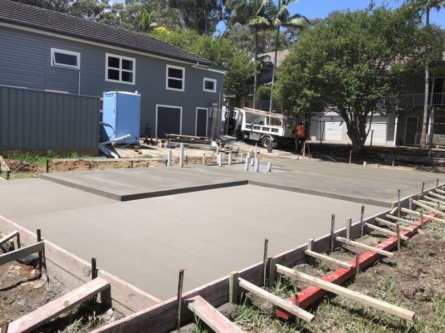 A Concrete Base Is Being Built In Front Of A House  — River2Coast Concreting in Boambee, NSW
