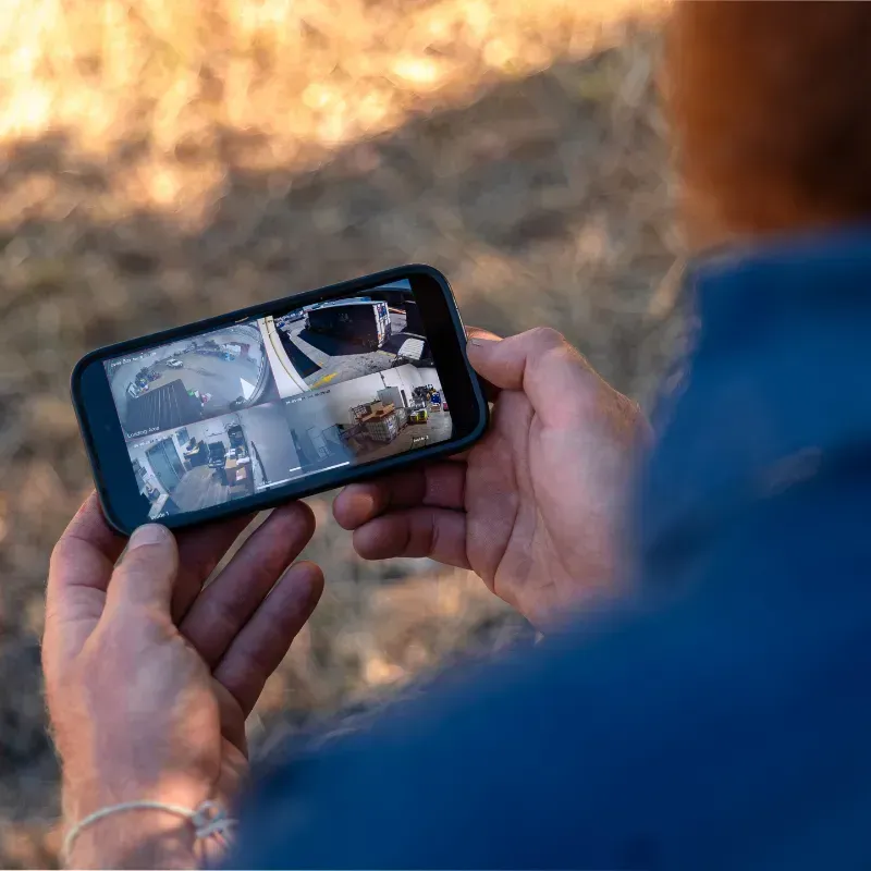 SPLIT-SCREEN SURVEILLANCE OF LIVE SECURITY CAMERA FOOTAGE ON A MOBILE PHONE