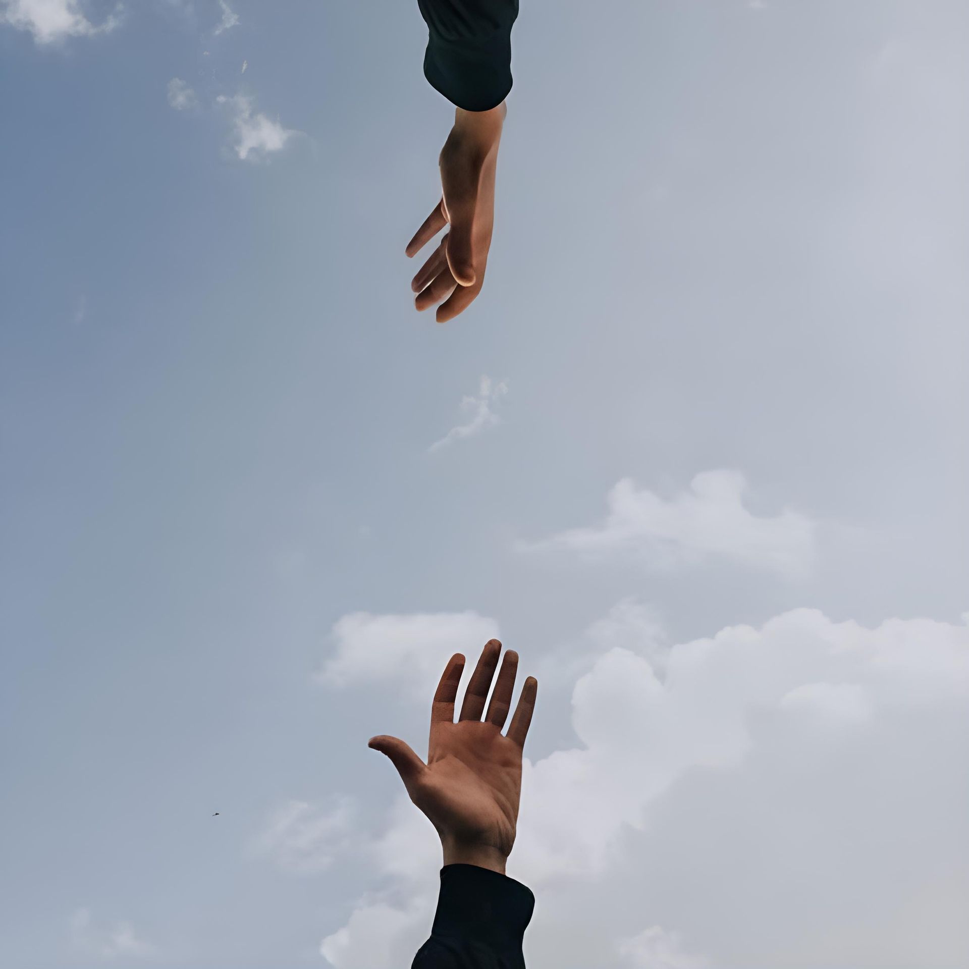 Two Hands Reaching Out Towards Each Other In The Sky — HealthPoint Mingara In Tumbi Umbi, NSW