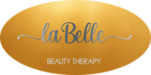 Logo dorato “laBelle” con volute decorative e la scritta “BEAUTY THERAPY” sottostante.