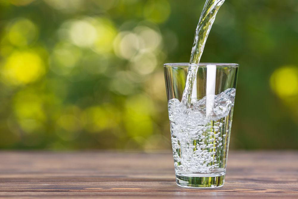 Water Being Poured Into a Glass — Rainman Domestic Water In Agnes Waters, QLD