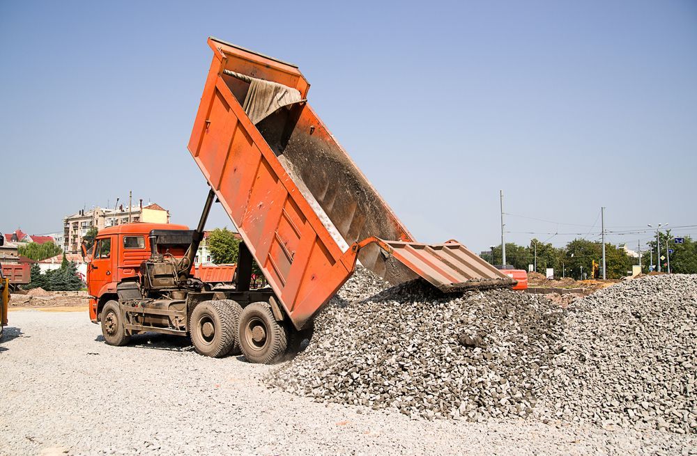 Truck Unloading Gravel at a Construction Site — Rainman Domestic Water In Avoca, QLD