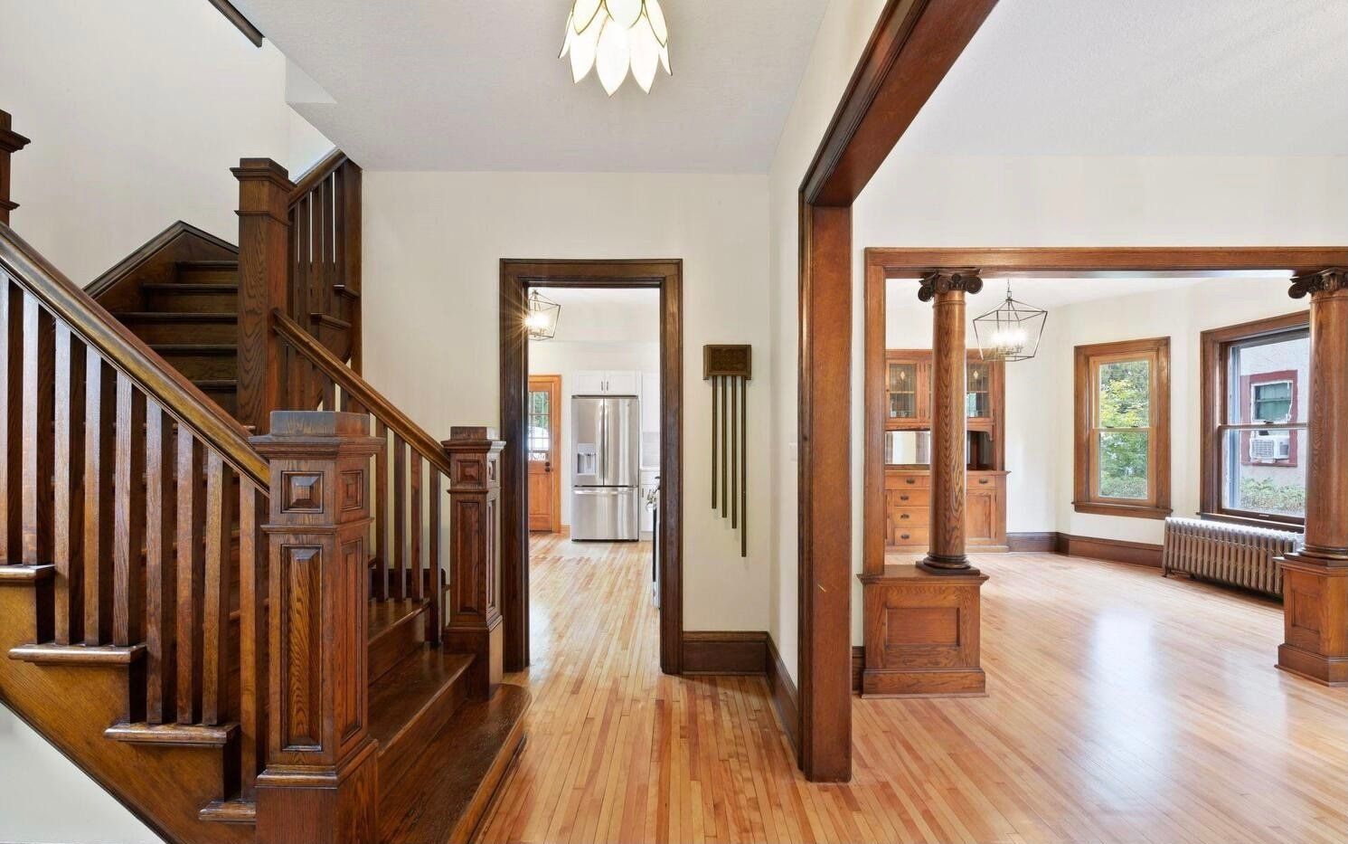A wooden staircase leading up to the second floor of a house