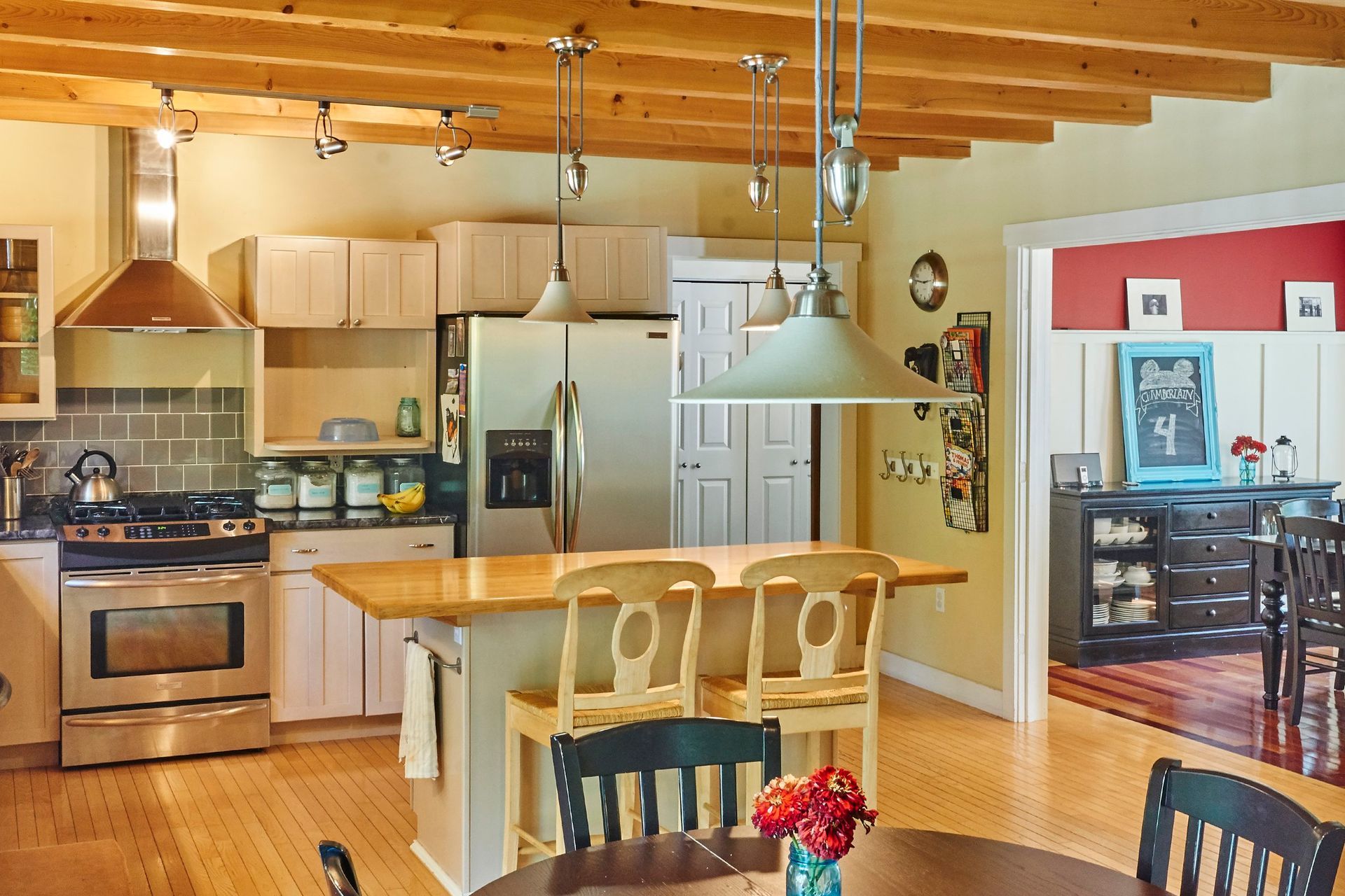 Whitecap Builders renovated a dining room with new windows and trim work for a coastal home in Lincolnville, Maine.