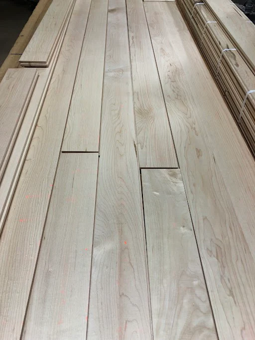 A bunch of wooden boards are stacked on top of each other