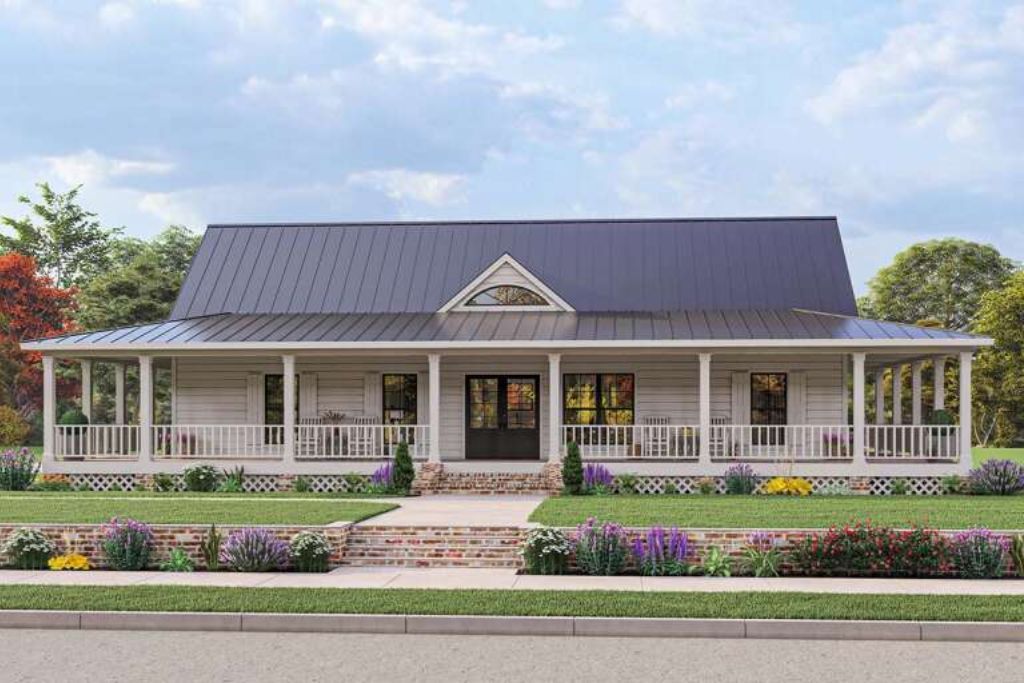 A large white house with a black roof and a large porch.