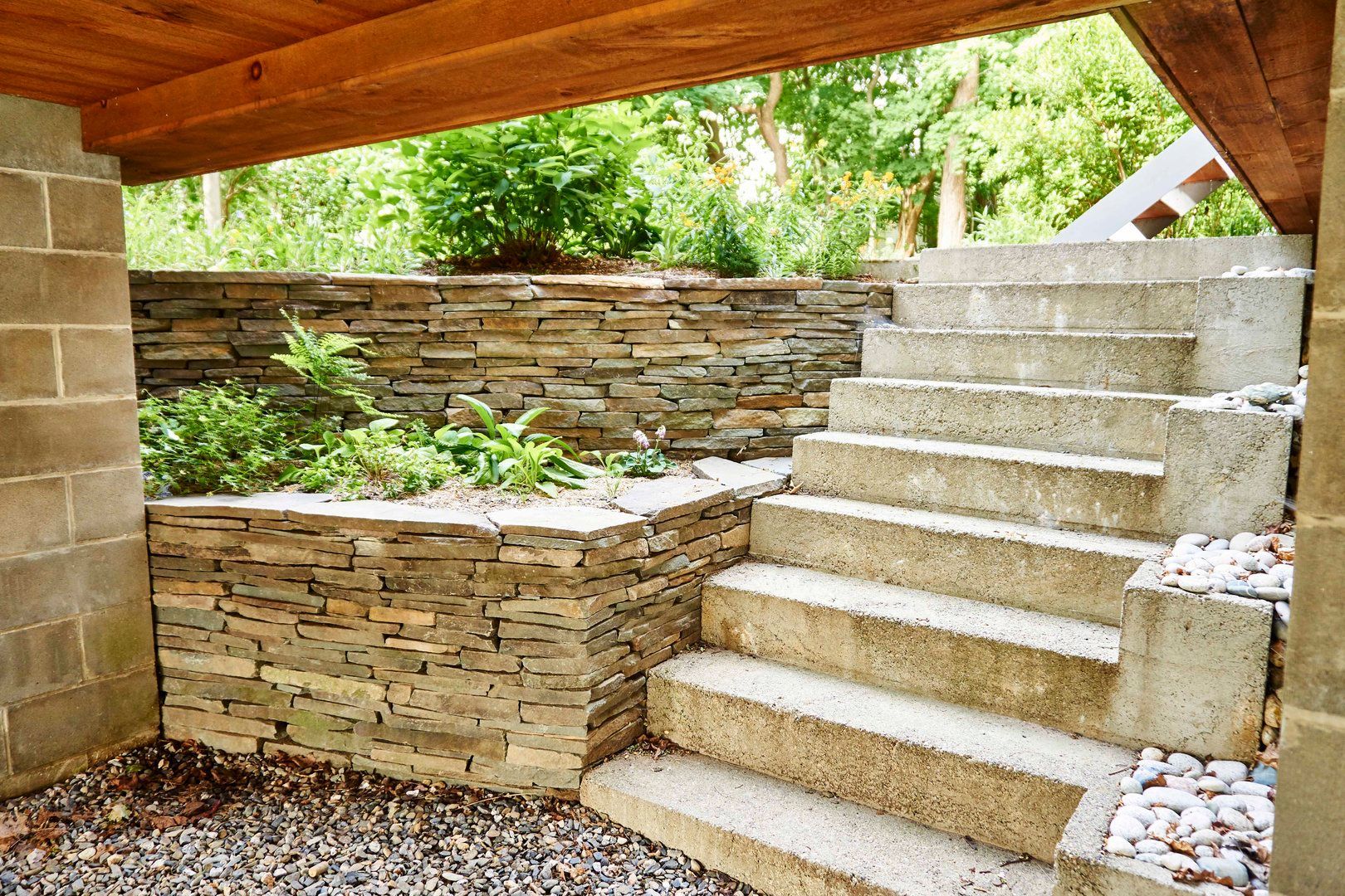 A set of stairs leading up to a stone wall