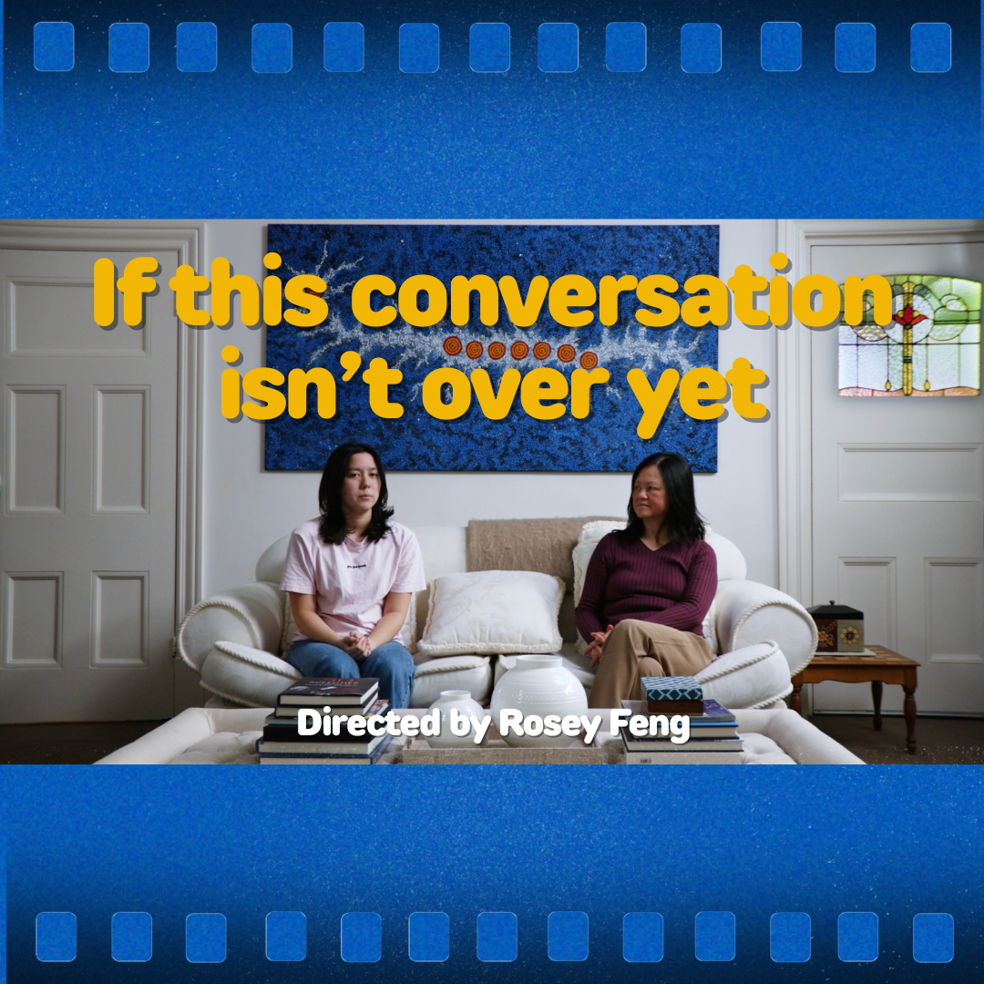 Two people sit on a couch in a living room; text reads “If this conversation isn’t over yet” and “Directed by Rosey Feng.”
