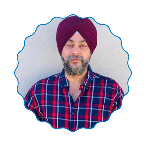 Portrait of a man in a maroon turban and red plaid shirt inside a scalloped blue frame
