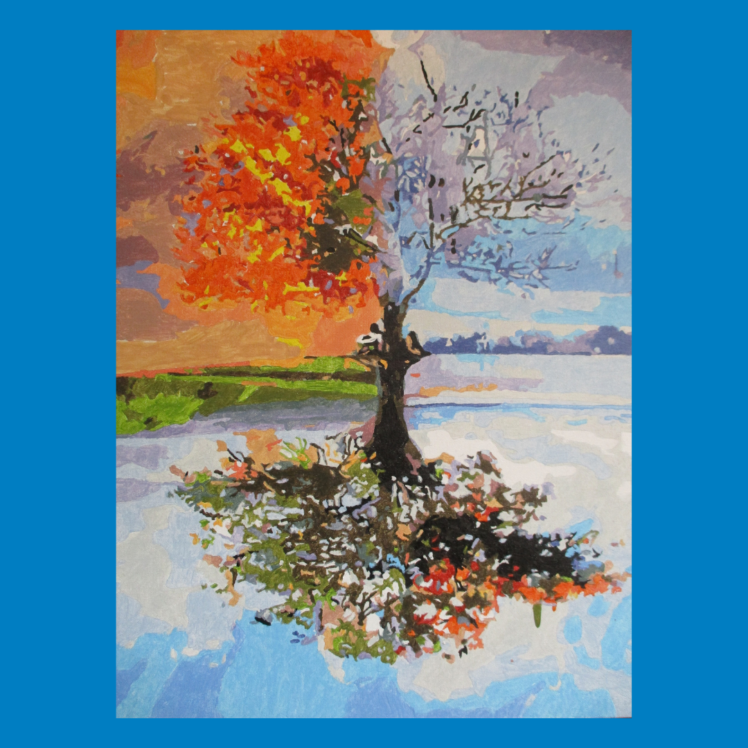 Colorful abstract tree reflected in calm water, with orange-red foliage and a blue sky background