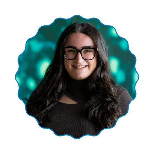 Smiling woman with glasses in a scalloped frame against a teal bokeh background