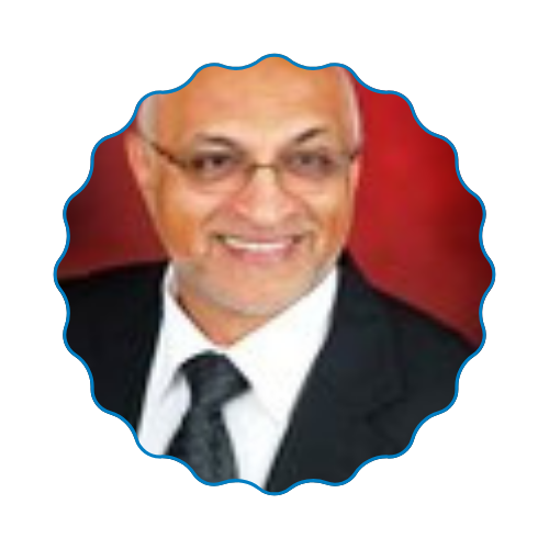 Portrait of a smiling man in glasses, suit, and tie against a red background