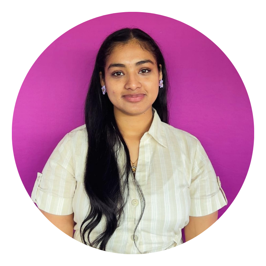 Portrait of a woman with long dark hair in a white shirt against a bright purple background