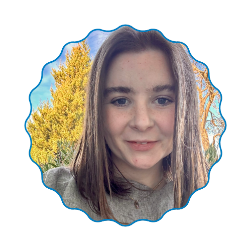 Portrait of a smiling person framed by a scalloped blue border, with yellow autumn trees behind them