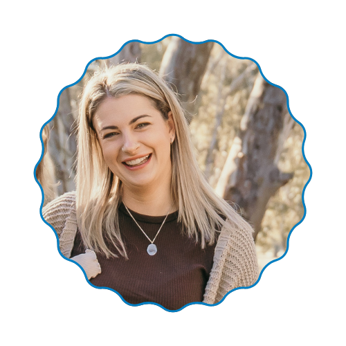 Portrait of a smiling blonde woman outdoors with a blue scalloped border