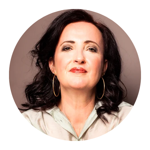 Portrait of a woman with dark hair, red lipstick, and hoop earrings against a plain background