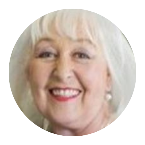 Smiling woman with short white hair in a circular portrait on a light background