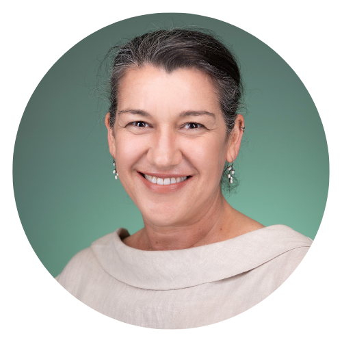 Headshot of a smiling woman against a green gradient background
