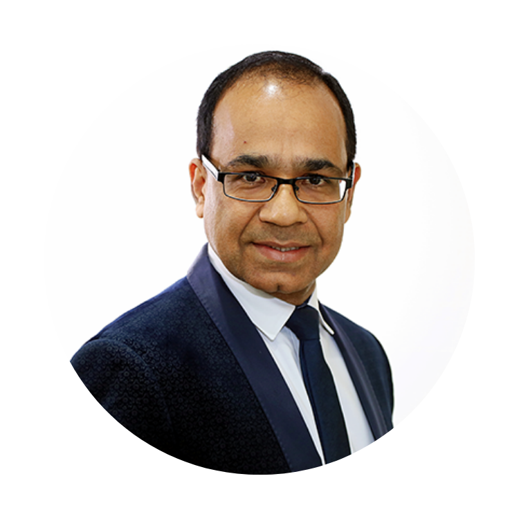 Headshot of a man in a dark suit and glasses on a white background