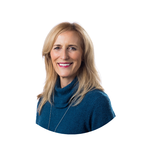 Smiling woman in a blue sweater with a blonde hairstyle on a white background