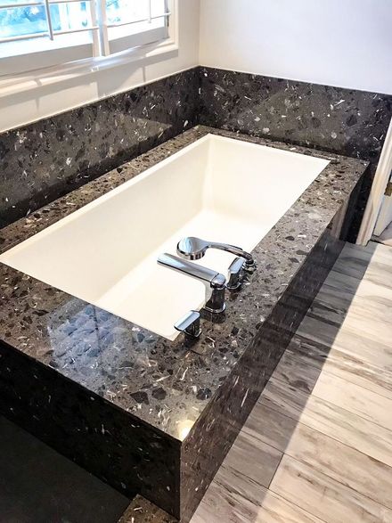Modern bathroom with a rectangular white soaking tub