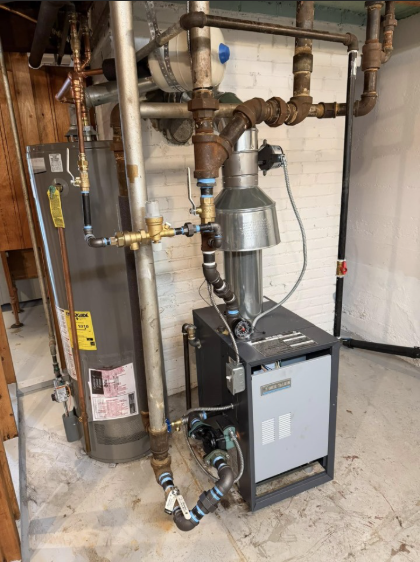 Heating system with water heater, pipes, and furnace in a basement setting.