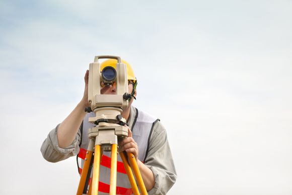 Surveyor engineer making measur