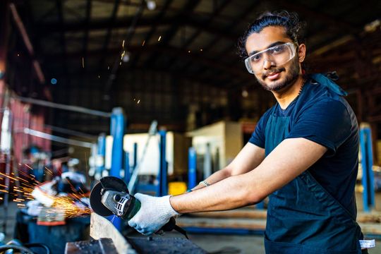 Welder Wearing Blue — Mellman & Perdue CPAs — Oakland, CA