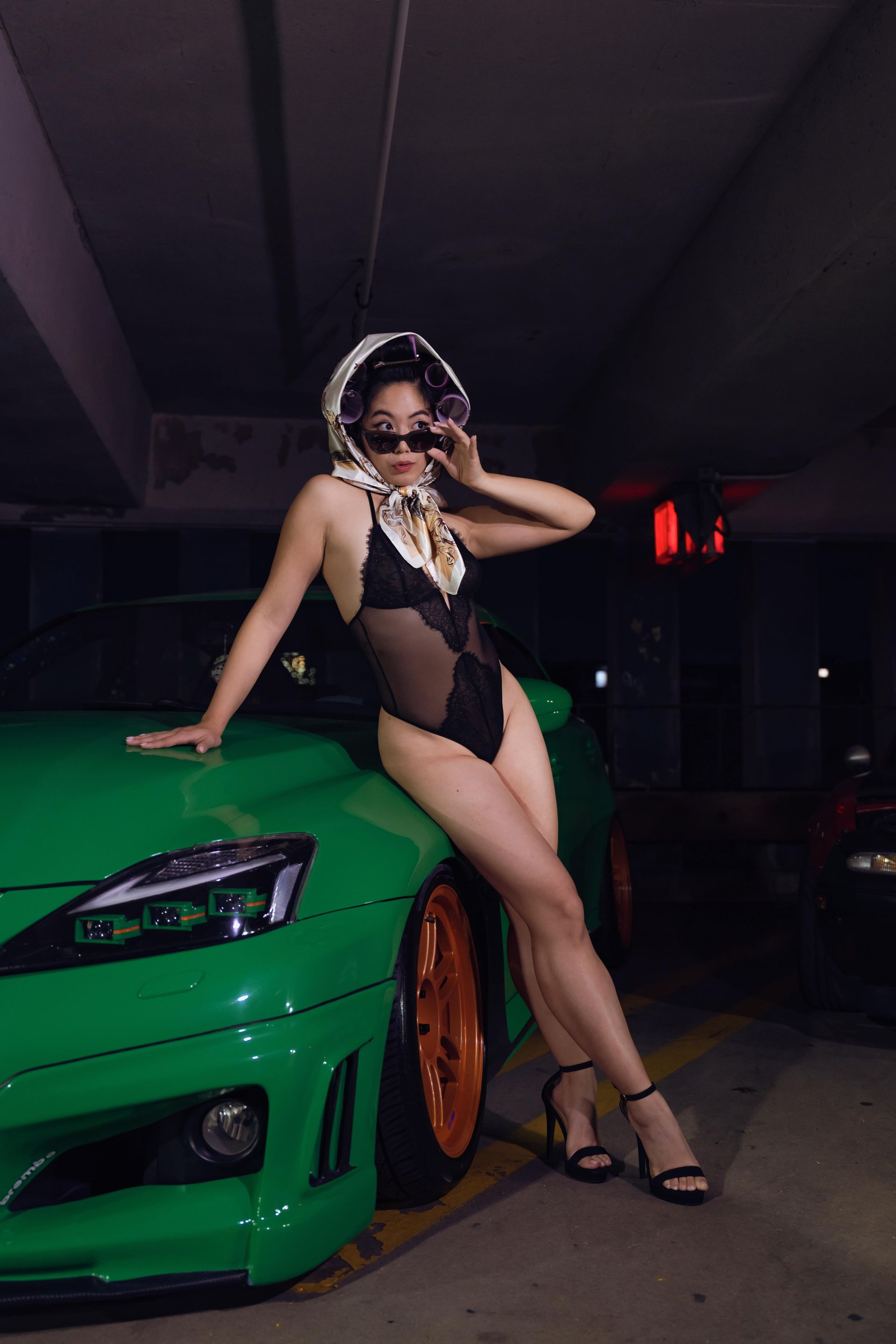 Editorial lingerie portrait referencing classic automotive pin-up imagery
