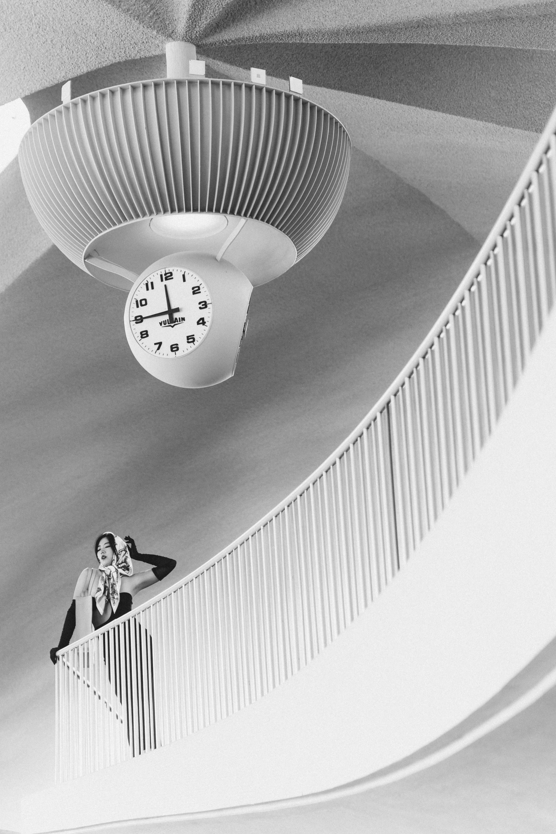 Luxury black and white editorial photography with dramatic refined pose