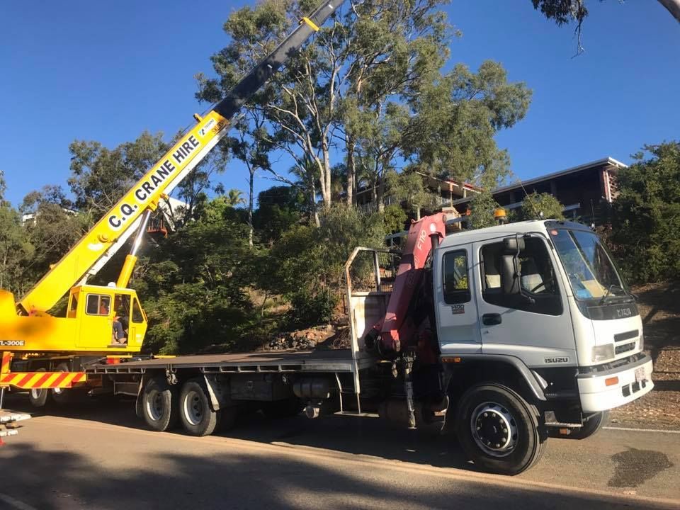Yellow Crane Truck with Extended Boom Lifting, Parked on Road — J & M Transport Plus in Rockhampton, QLD