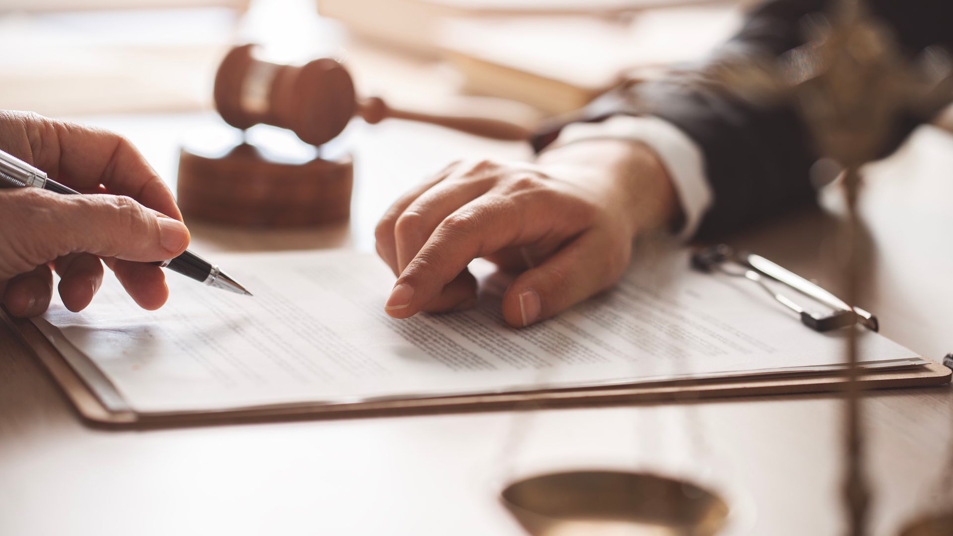 Two people are going over a contract.
