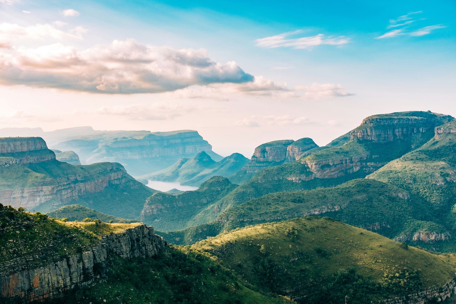 a view of a mountain range with a river in the middle of it .