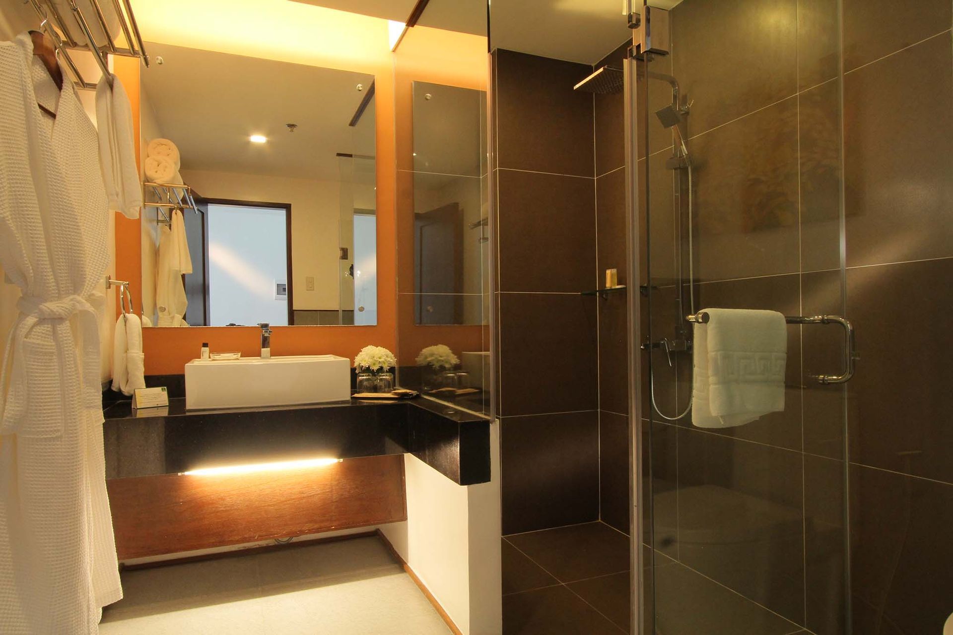 Luxury hotel bathroom with glass shower at Harvest Hotel Cabanatuan