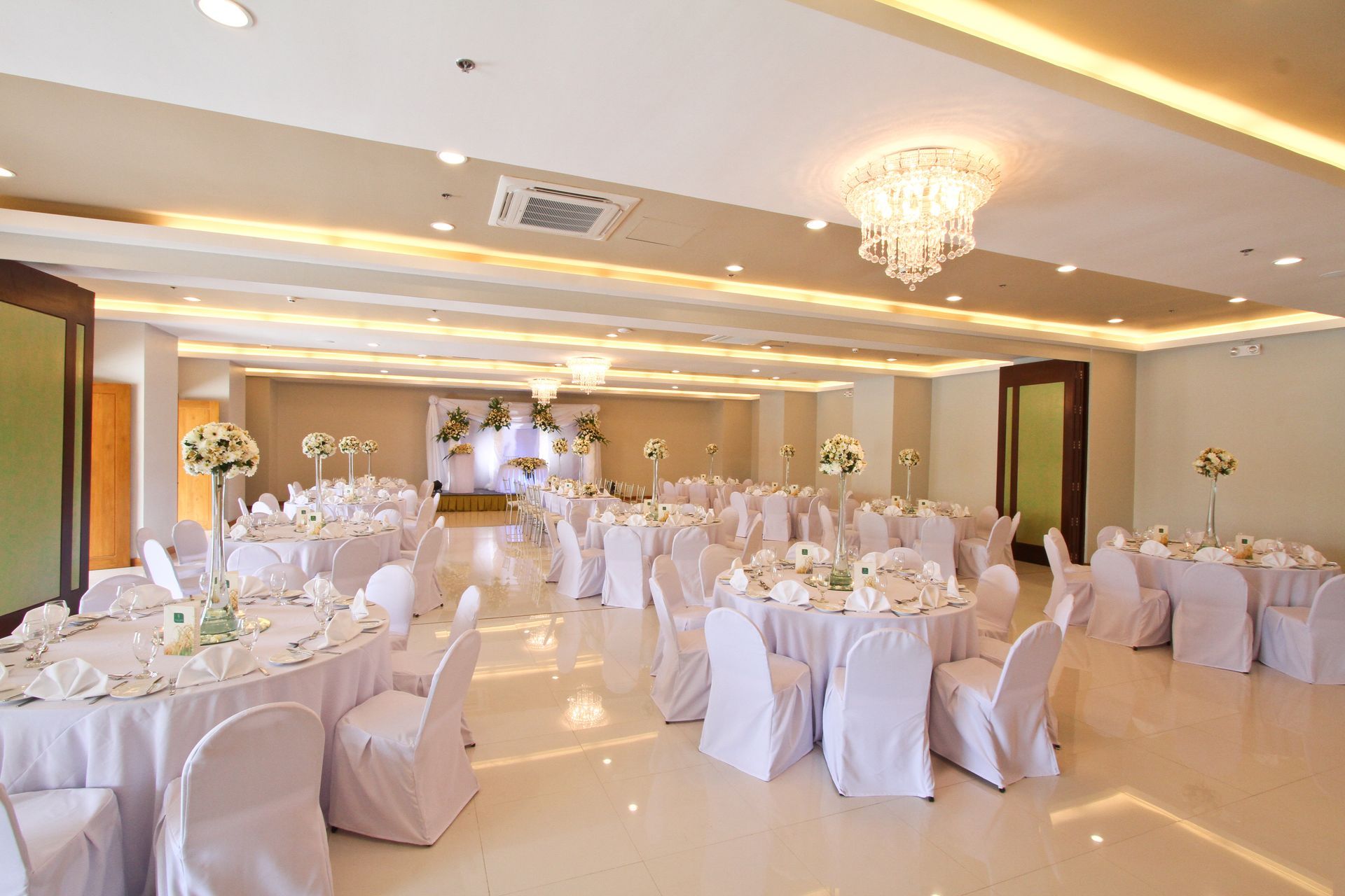 The grand banquet hall at Harvest Hotel set up for a wedding, a premier event venue in Cabanatuan for large celebrations and conventions.